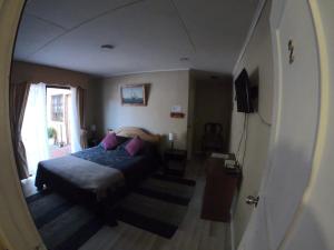 Ein Bett oder Betten in einem Zimmer der Unterkunft Hostal Los Guindos
