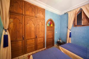 Postel nebo postele na pokoji v ubytování Riad Bab Tilila