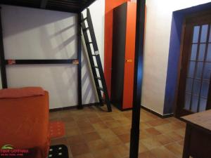 a room with a bunk bed with a ladder at Host Historic Centre Naples in Naples