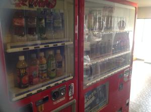 a red refrigerator filled with lots of drinks at Asano Hotel in Kitakyushu