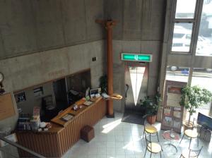 a lobby of a train station with a desk at Asano Hotel in Kitakyushu