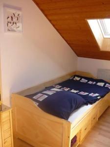 a bedroom with a bed in a attic at Ferienwohnung am Ludwigstein in Spiegelau