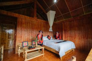 Postel nebo postele na pokoji v ubytování Hoang Su Phi Lodge