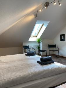 a bedroom with a large bed with two pillows on it at Sonnige Wohnung im Herzen von Marbach in Marbach am Neckar