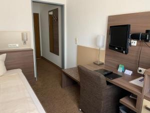 TV a/nebo společenská místnost v ubytování Hotel Buntrock