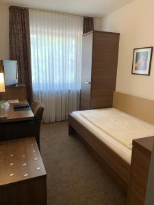 Ein Bett oder Betten in einem Zimmer der Unterkunft Hotel Buntrock