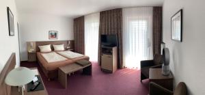 TV a/nebo společenská místnost v ubytování Hotel Buntrock
