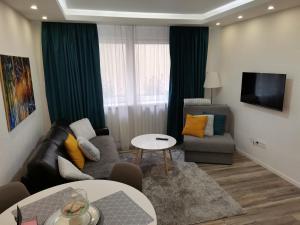a living room with a couch and a chair at Moonlight Visoko in Visoko