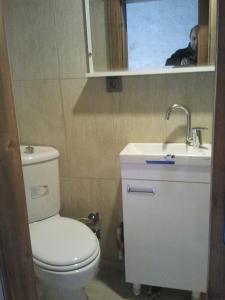 a bathroom with a toilet and a sink and a mirror at Turkmen Konagi in Sanlıurfa