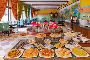 a buffet of food on a table in a restaurant at Basma Hotel Aswan in Aswan