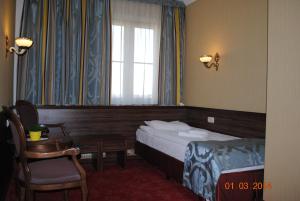 Posteľ alebo postele v izbe v ubytovaní Hotel Złoty Młyn Majków