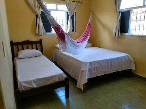 Ein Bett oder Betten in einem Zimmer der Unterkunft Pousada Formosa Baia