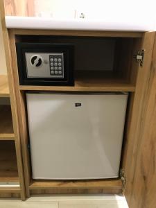 a microwave oven sitting inside of a cabinet at Holiday house in Vinnytsya