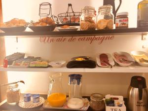 an open refrigerator shelf with a sign on it at House Petit Lusa in Lisbon