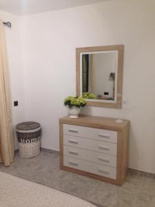a dresser with a mirror on top of it at Castillo Mar 87 in Caleta De Fuste
