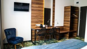 TV a/nebo společenská místnost v ubytování Bloom Hotel Airport Okęcie
