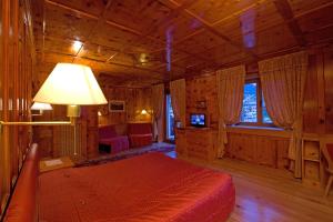 Un pat sau paturi într-o cameră la Hotel La Montanina
