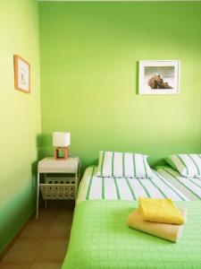 Katil atau katil-katil dalam bilik di Casa do Lado