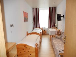 Ένα ή περισσότερα κρεβάτια σε δωμάτιο στο Hotel "Wilder Mann"