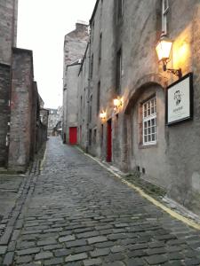 an empty cobblestone street in an old building at EdinB&B in Edinburgh