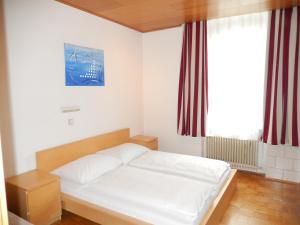 Ένα ή περισσότερα κρεβάτια σε δωμάτιο στο Hotel "Wilder Mann"