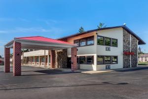 a store front of a building with a garage at Econo Lodge in Wooster