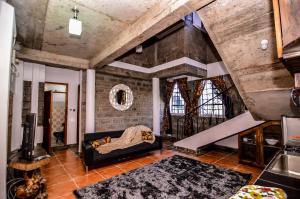 Postel nebo postele na pokoji v ubytování Runda Lofts