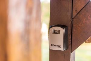 a socket on a wooden door with the word massey on it at Kuća za odmor Atar in Bartolovci
