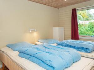 A bed or beds in a room at 6 person holiday home in B rkop