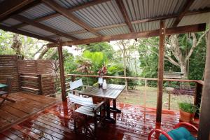 a wooden deck with a table and chairs on it at 305A - The Artist's Cottage in Montville