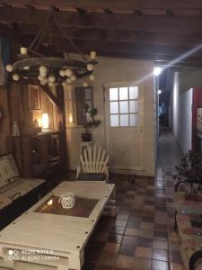 a living room with a couch and a table at Playa, bosque y lago in Montevideo