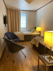 Postel nebo postele na pokoji v ubytování Strand City Hotel