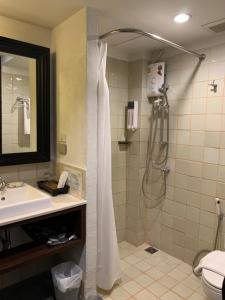 a bathroom with a shower and a sink at 99 The Gallery Hotel- SHA Extra Plus in Chiang Mai