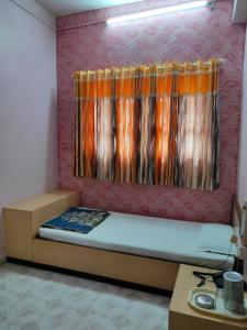 Postel nebo postele na pokoji v ubytování Hotel Ayodhya