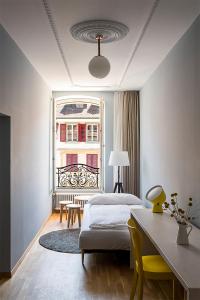 Postel nebo postele na pokoji v ubytování ADLER Boutique Hotel