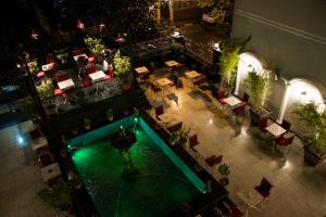 an overhead view of a restaurant with a swimming pool at Hotel Elysee in Tirana