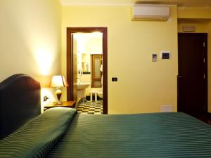 Postel nebo postele na pokoji v ubytování Relax Style House Central Rooms