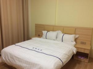 Ένα ή περισσότερα κρεβάτια σε δωμάτιο στο Li Jie Coffee Homestay