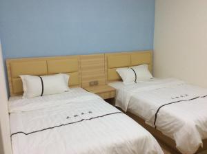 Ένα ή περισσότερα κρεβάτια σε δωμάτιο στο Li Jie Coffee Homestay