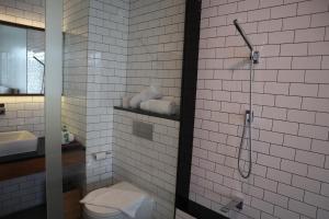 Vannituba majutusasutuses Nagomi Suites & Hotel