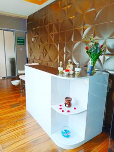 a room with a counter with flowers on it at Holiday Inn Dar Es Salaam, an IHG Hotel in Dar es Salaam