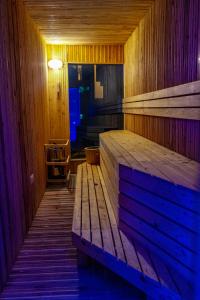 a sauna with a wooden bench in a room at Holiday Inn Dar Es Salaam, an IHG Hotel in Dar es Salaam