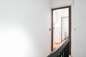 a mirror on a wall next to a stairway at Square views in Lerici