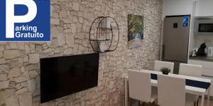 Televízia a/alebo spoločenská miestnosť v ubytovaní Apartamento EL CARMEN con Parking GRATIS