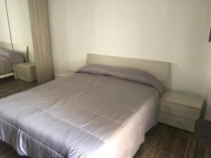 Кровать или кровати в номере La Bellavista Mola di Bari