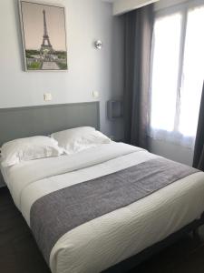Postel nebo postele na pokoji v ubytování Hôtel Clauzel Paris