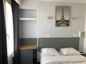 Postel nebo postele na pokoji v ubytování Hôtel Clauzel Paris