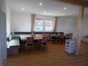 a large dining room with a table and chairs at Hofstadl Sonja Liebhart in Merkenbrechts +9 photos