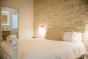 A bed or beds in a room at Selecta Apart ideal y facil parking en la calle