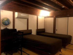 Ένα ή περισσότερα κρεβάτια σε δωμάτιο στο Guesthouse Wasabi